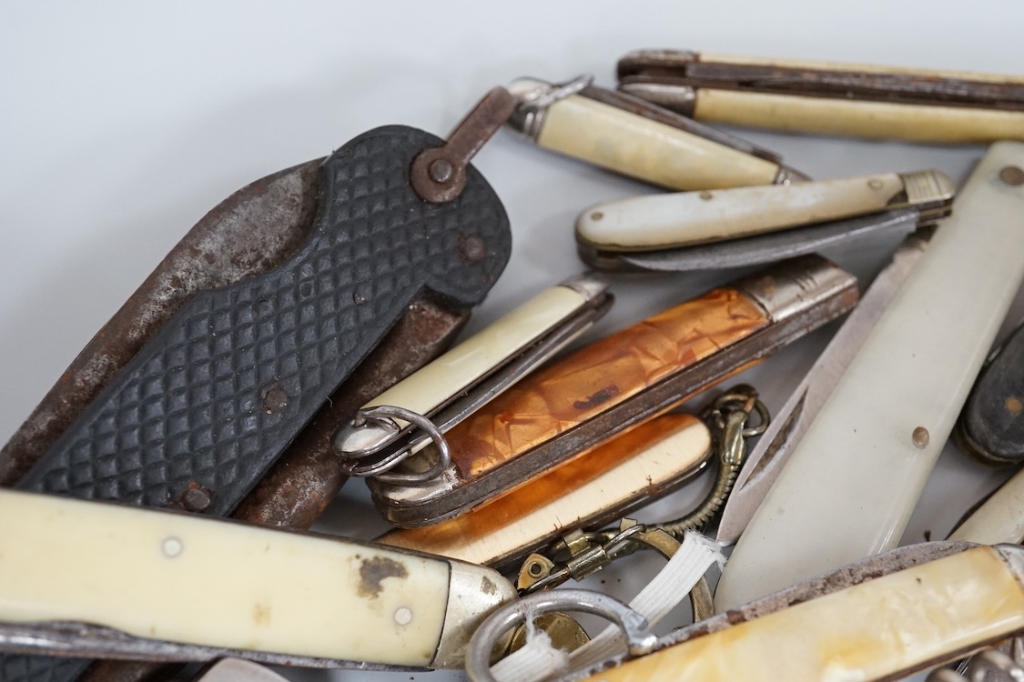 A collection of assorted penknives and whistles